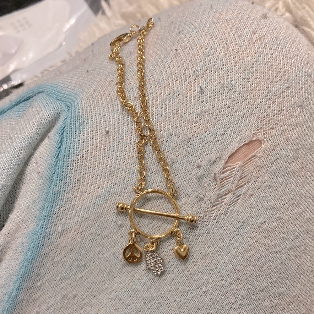 Gold filled bracelet with 3 charms peace symbol hand of god and a heart